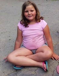 small girl in shorts